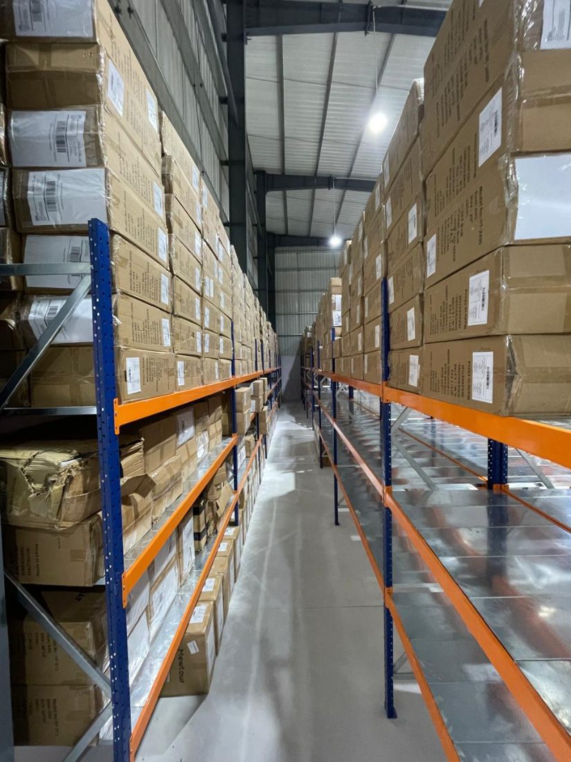 Fully stocked warehouse racking aisle